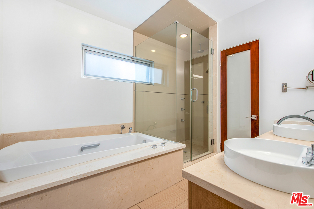 717 South Broadway, Unit B Redondo Beach, CA 90277 - Photo 13 of 29 a bathroom with a sink and a large mirror