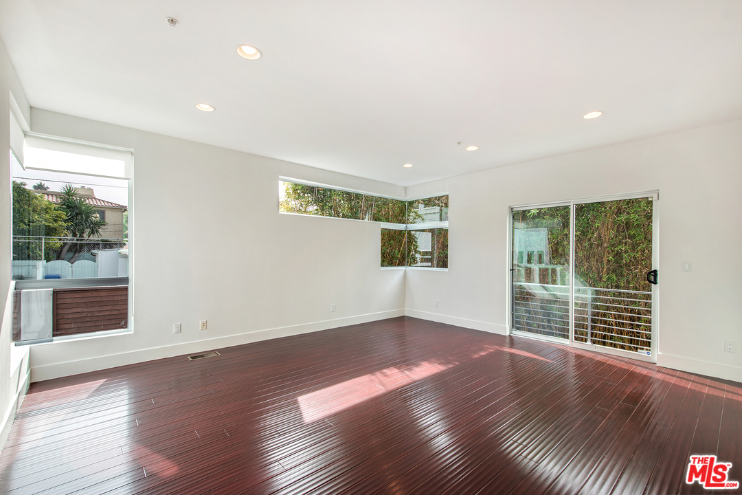 717 South Broadway, Unit B Redondo Beach, CA 90277 - Photo 4 of 29 a view of wooden floor and windows in a room