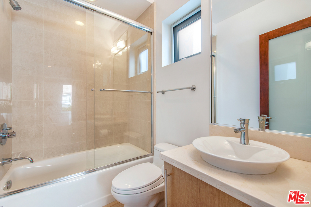 717 South Broadway, Unit B Redondo Beach, CA 90277 - Photo 10 of 29 a bathroom with a sink toilet and shower