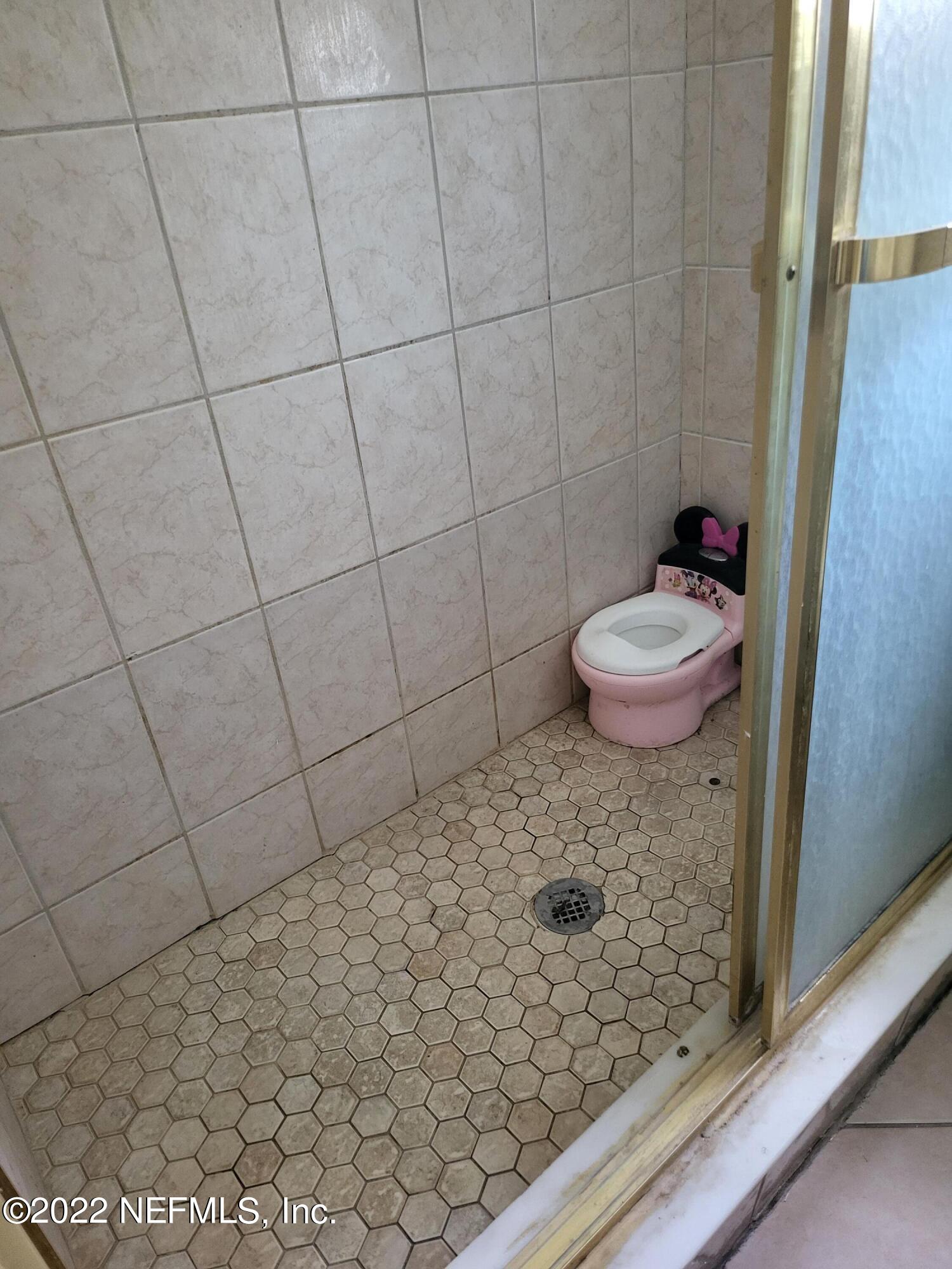 2529 Sam Road Jacksonville, FL 32216 - Photo 6 of 12 a bathroom with a sink and a mirror