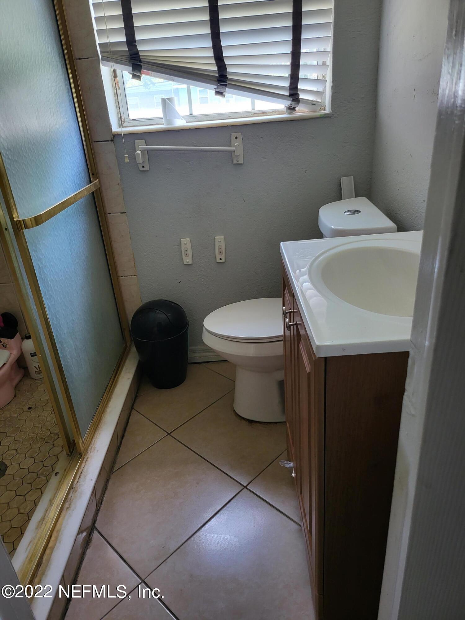2529 Sam Road Jacksonville, FL 32216 - Photo 8 of 12 a bathroom with a sink and a toilet
