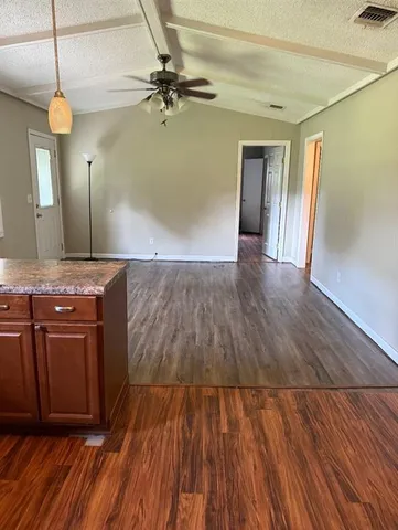 a view of a kitchen from a room