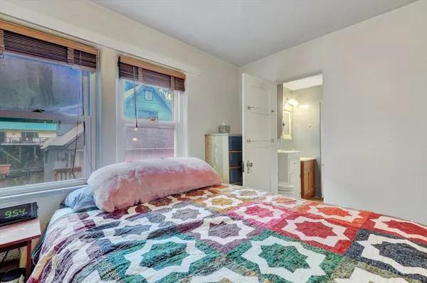 a bathroom with a tub sink and shower
