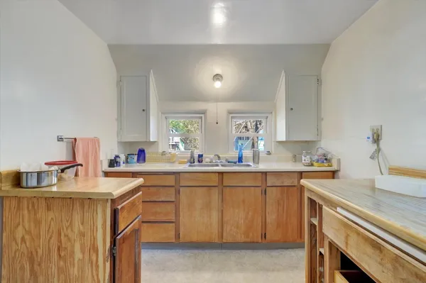 a view of a workspace with furniture