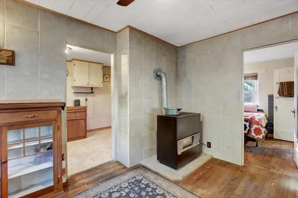 a living room with furniture a window and a table