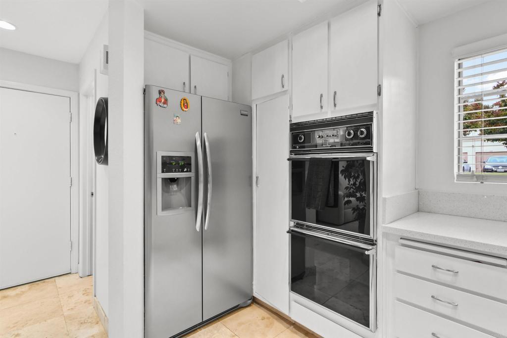 760 Eastshore Terrace, Unit 139 Chula Vista, CA 91913 - Photo 13 of 34 a kitchen with refrigerator and cabinets