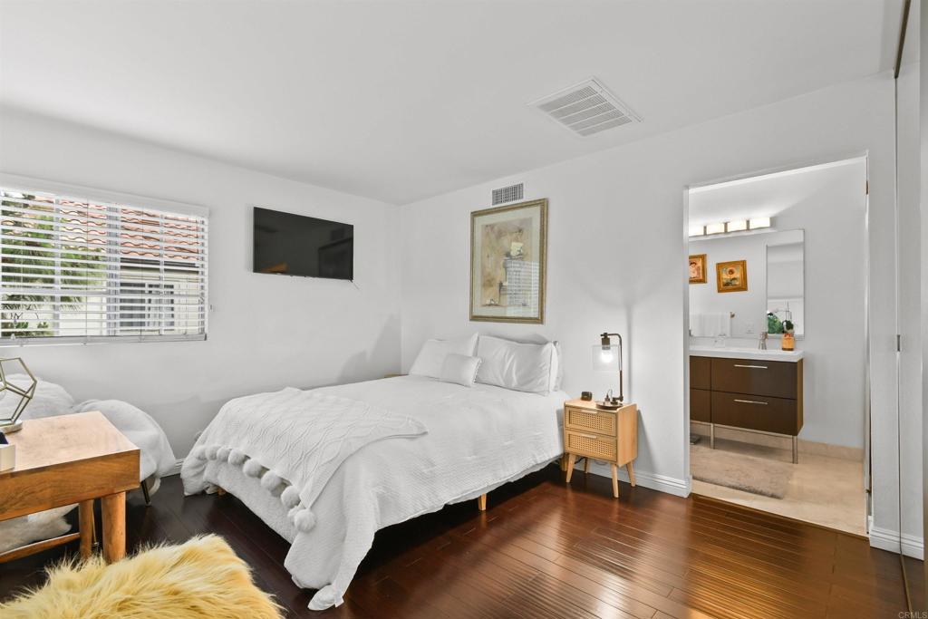 760 Eastshore Terrace, Unit 139 Chula Vista, CA 91913 - Photo 14 of 34 a bedroom with a bed and a view of kitchen