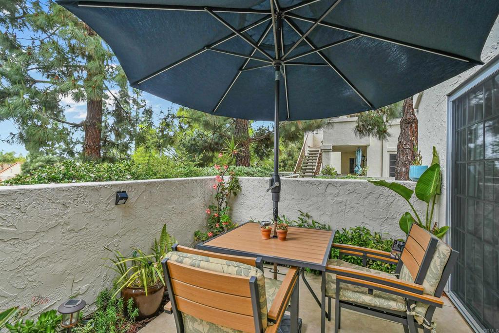 760 Eastshore Terrace, Unit 139 Chula Vista, CA 91913 - Photo 20 of 34 a patio with a patio table and chairs