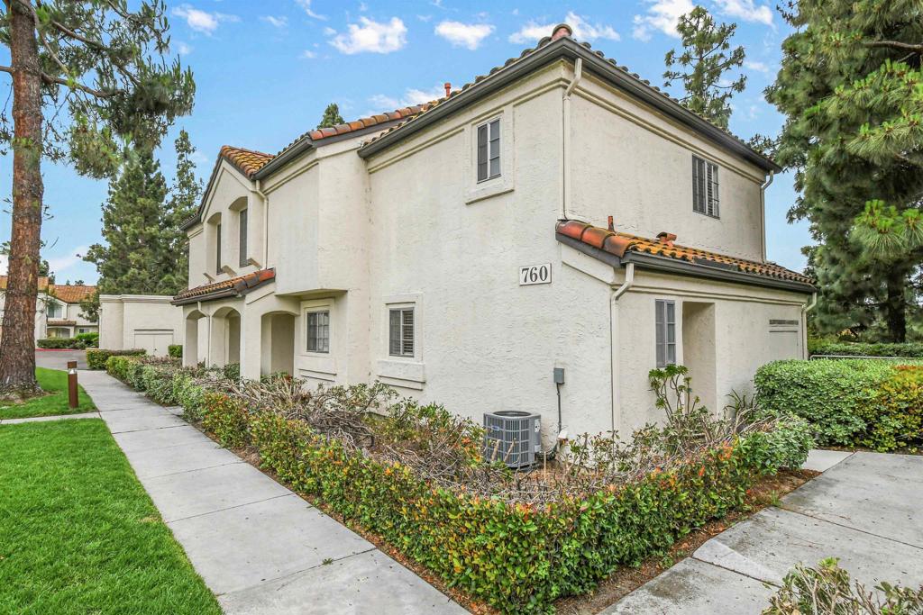 760 Eastshore Terrace, Unit 139 Chula Vista, CA 91913 - Photo 2 of 34 a front view of a house with garden