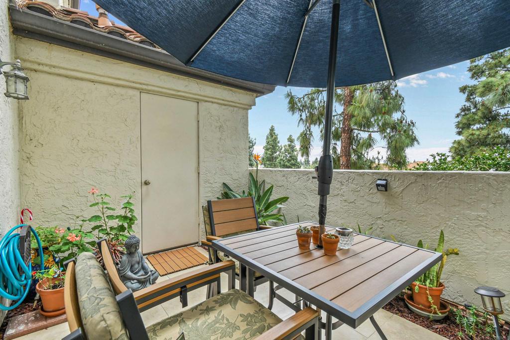 760 Eastshore Terrace, Unit 139 Chula Vista, CA 91913 - Photo 21 of 34 a view of table and chair under an umbrella