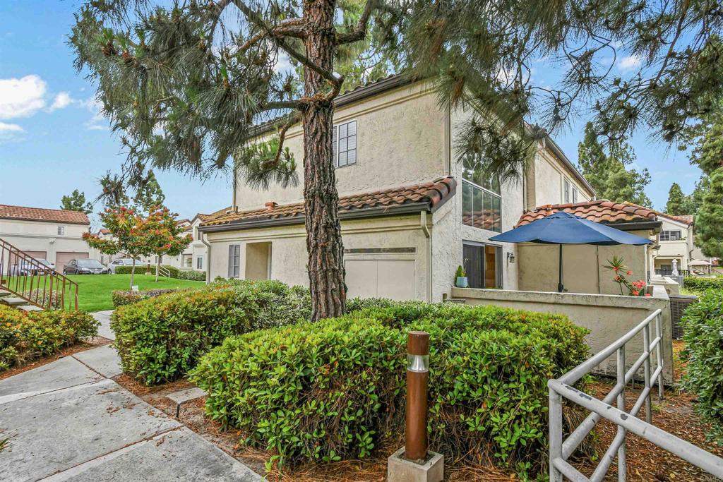 760 Eastshore Terrace, Unit 139 Chula Vista, CA 91913 - Photo 4 of 34 front view of a house with a garden