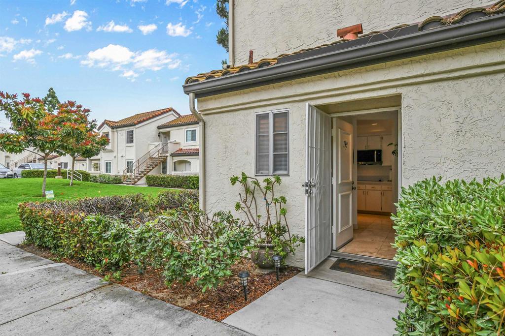 760 Eastshore Terrace, Unit 139 Chula Vista, CA 91913 - Photo 5 of 34 front view of a house with a garden