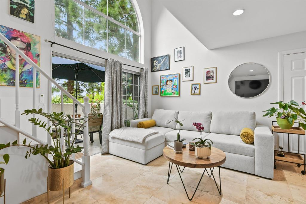 760 Eastshore Terrace, Unit 139 Chula Vista, CA 91913 - Photo 6 of 34 a living room with furniture and flowers
