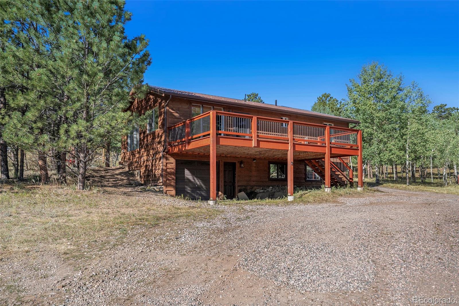249 Burland Drive Bailey, CO 80421 - Photo 20 of 24 a view of a house with a porch