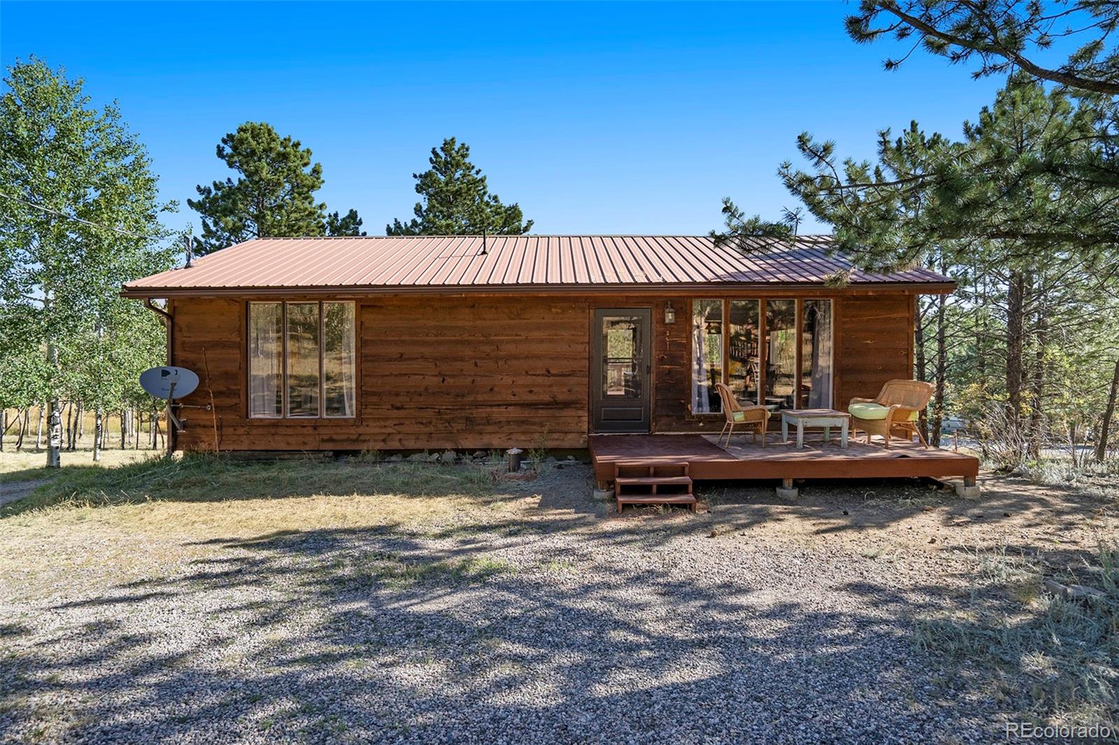 249 Burland Drive Bailey, CO 80421 - Photo 24 of 24 a front view of a house with garden