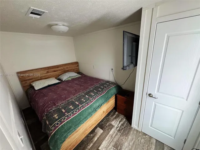 a white toilet sitting next to a shower curtain