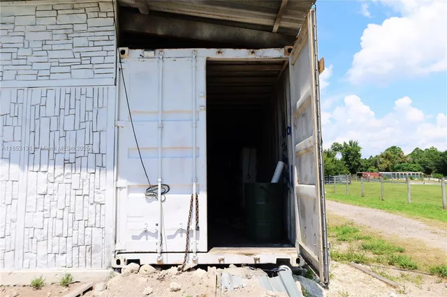 a room with furniture and gym equipment