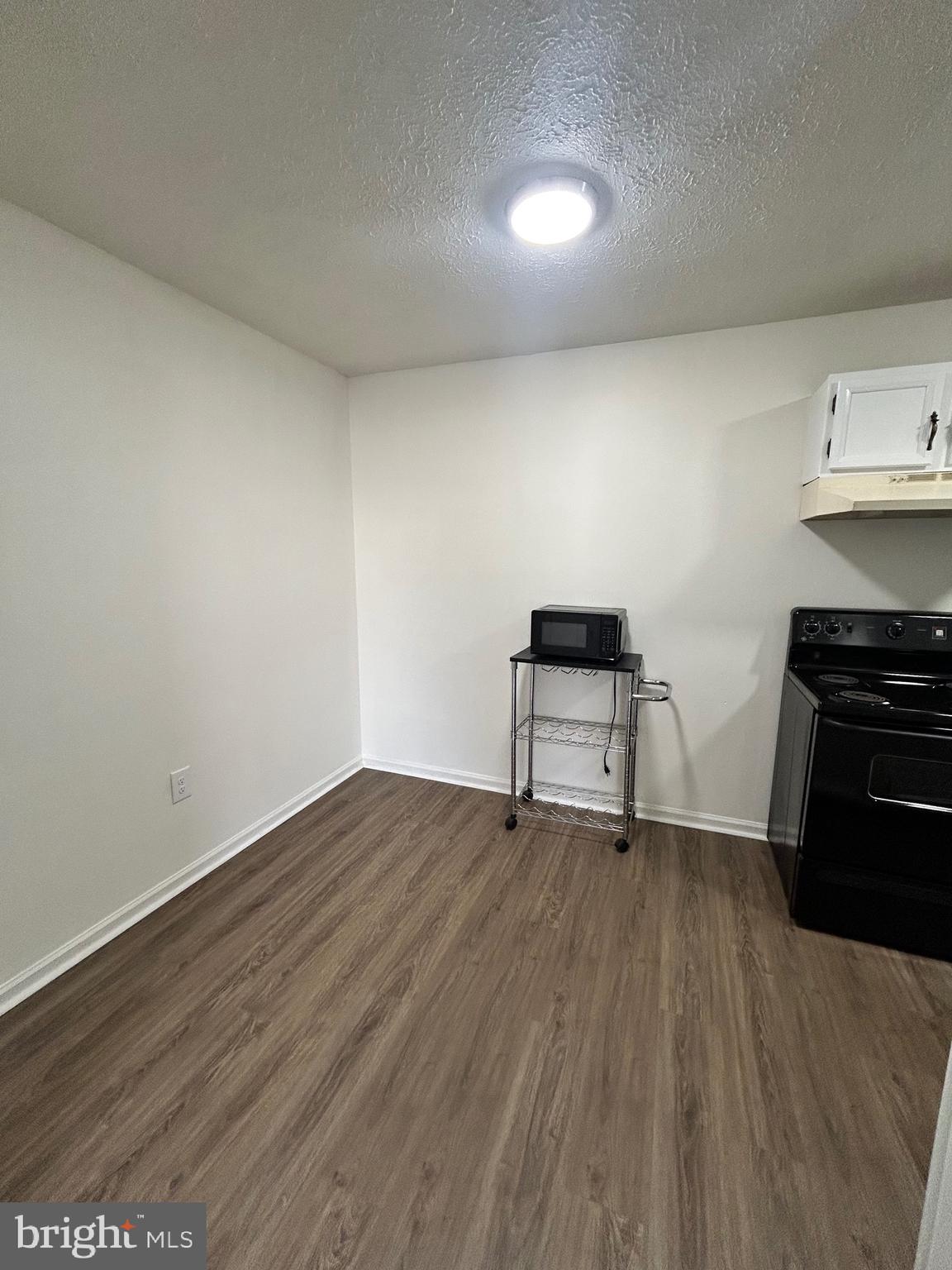 2401 Papermill Road, Unit 5 Winchester, VA 22601 - Photo 5 of 7 a view of workspace with wooden floor and cabinets