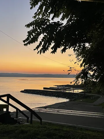 a view of lake with sunset