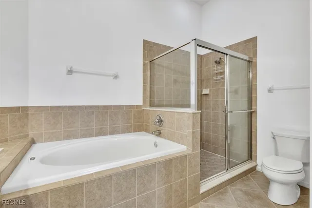 a spacious bathroom with a double vanity sink mirror and