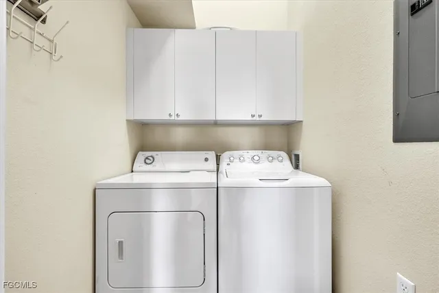 a balcony with furniture and a view of city