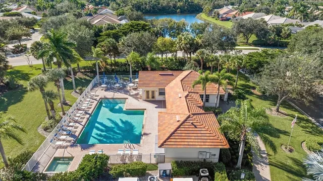 an aerial view of ocean with residential house with outdoor space