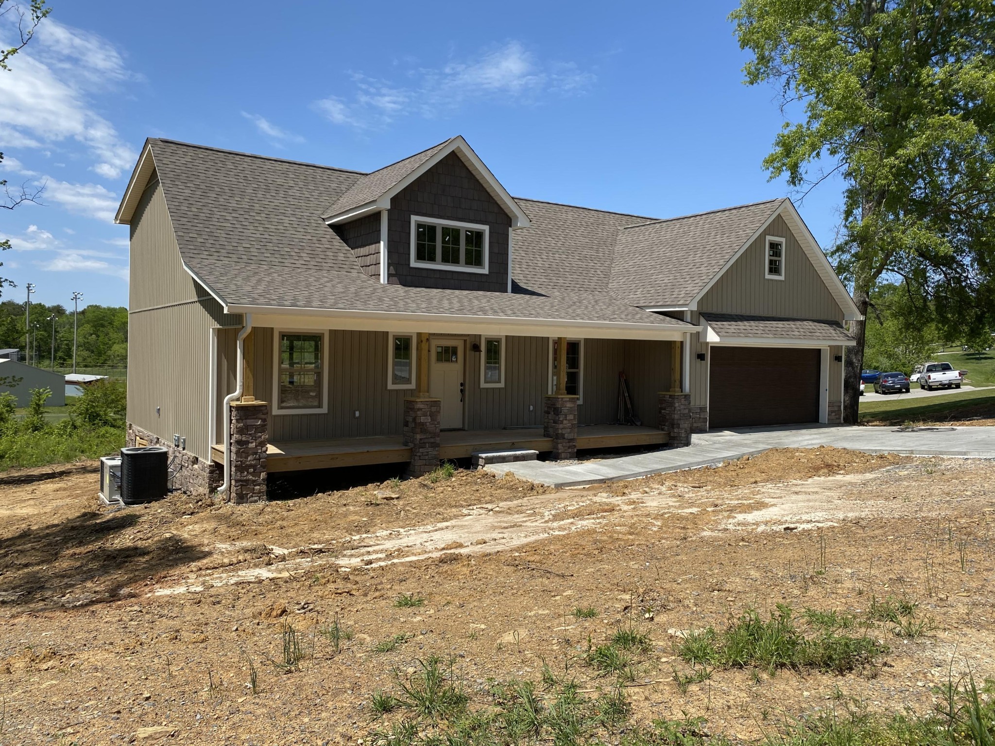 185 West Park Circle Decatur, TN 37322 - Photo 1 of 11 a front view of a house with a yard