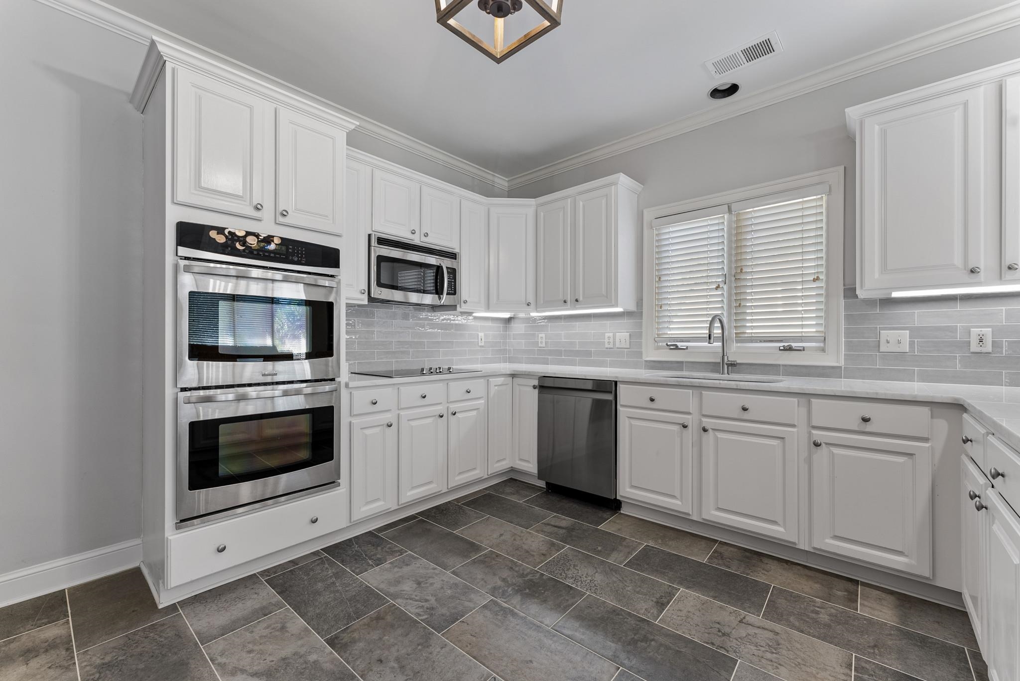 2161 Gallina Circle Collierville, TN 38017 - Photo 15 of 25 a kitchen with cabinets stainless steel appliances and window