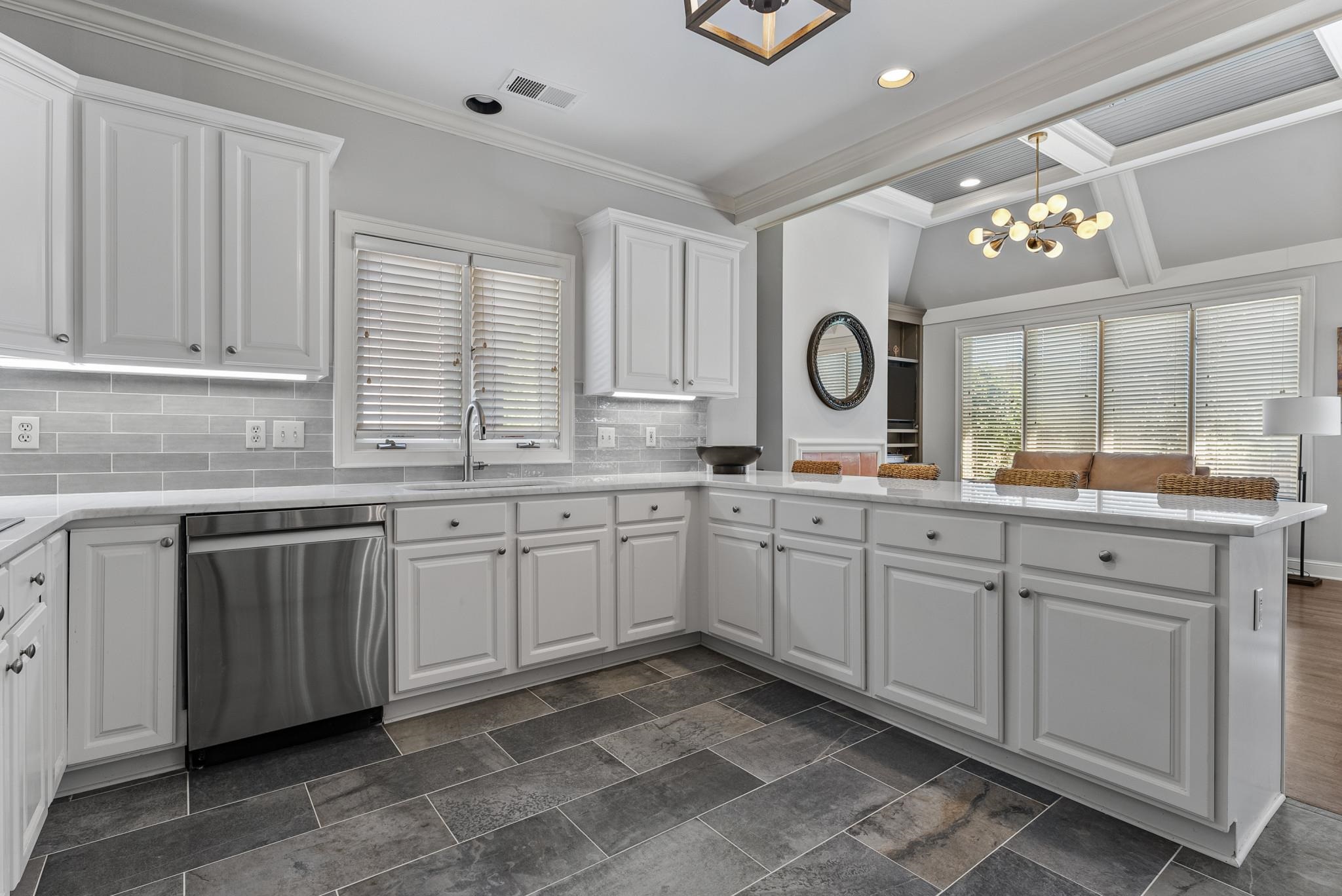 2161 Gallina Circle Collierville, TN 38017 - Photo 16 of 25 a kitchen with granite countertop a sink cabinets and window