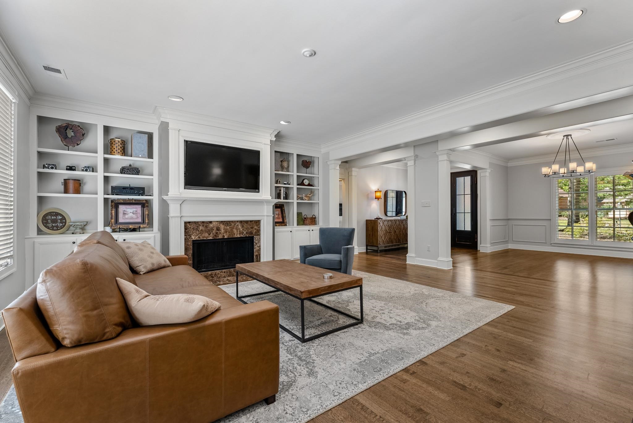 2161 Gallina Circle Collierville, TN 38017 - Photo 8 of 25 a living room with furniture a flat screen tv and a fireplace