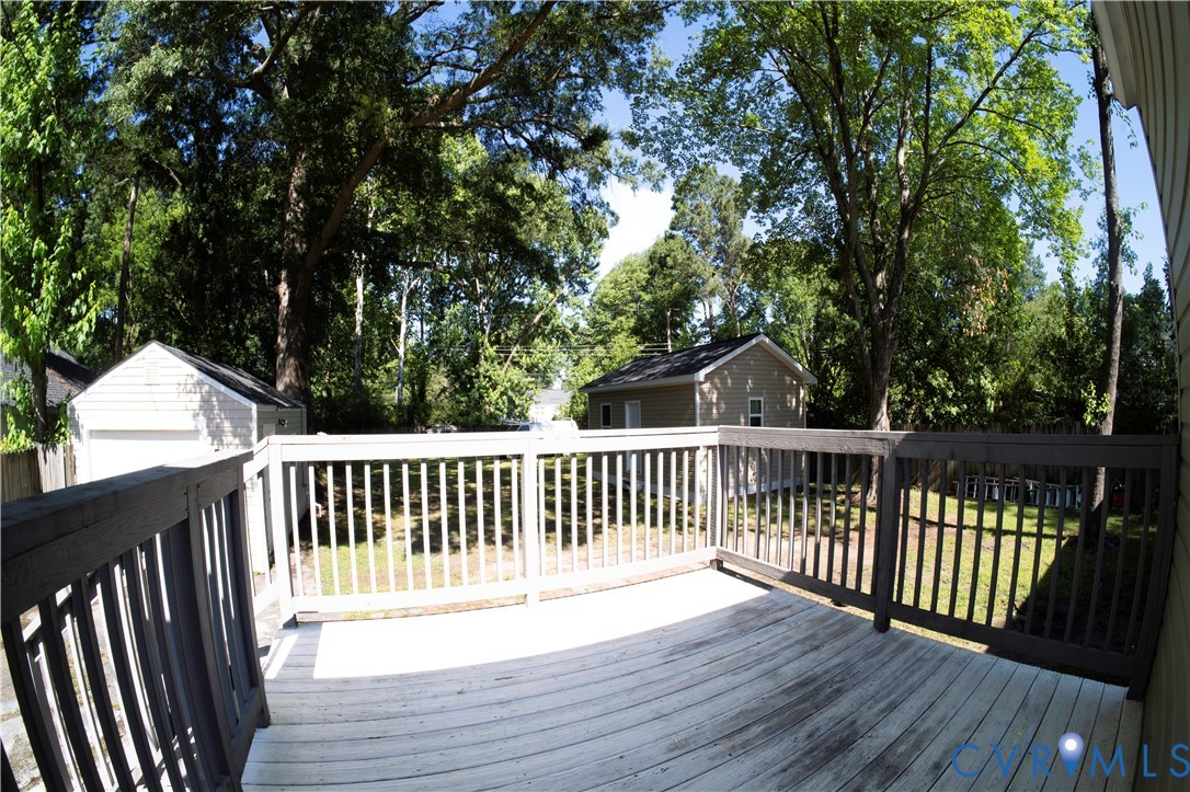 2718 Stacie Road Richmond, VA 23224 - Photo 32 of 50 Deck looking at backyard with mature trees