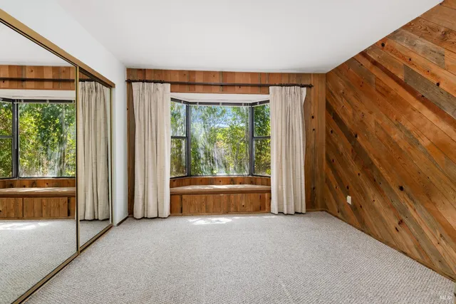 a view of room with window and floor to ceiling window