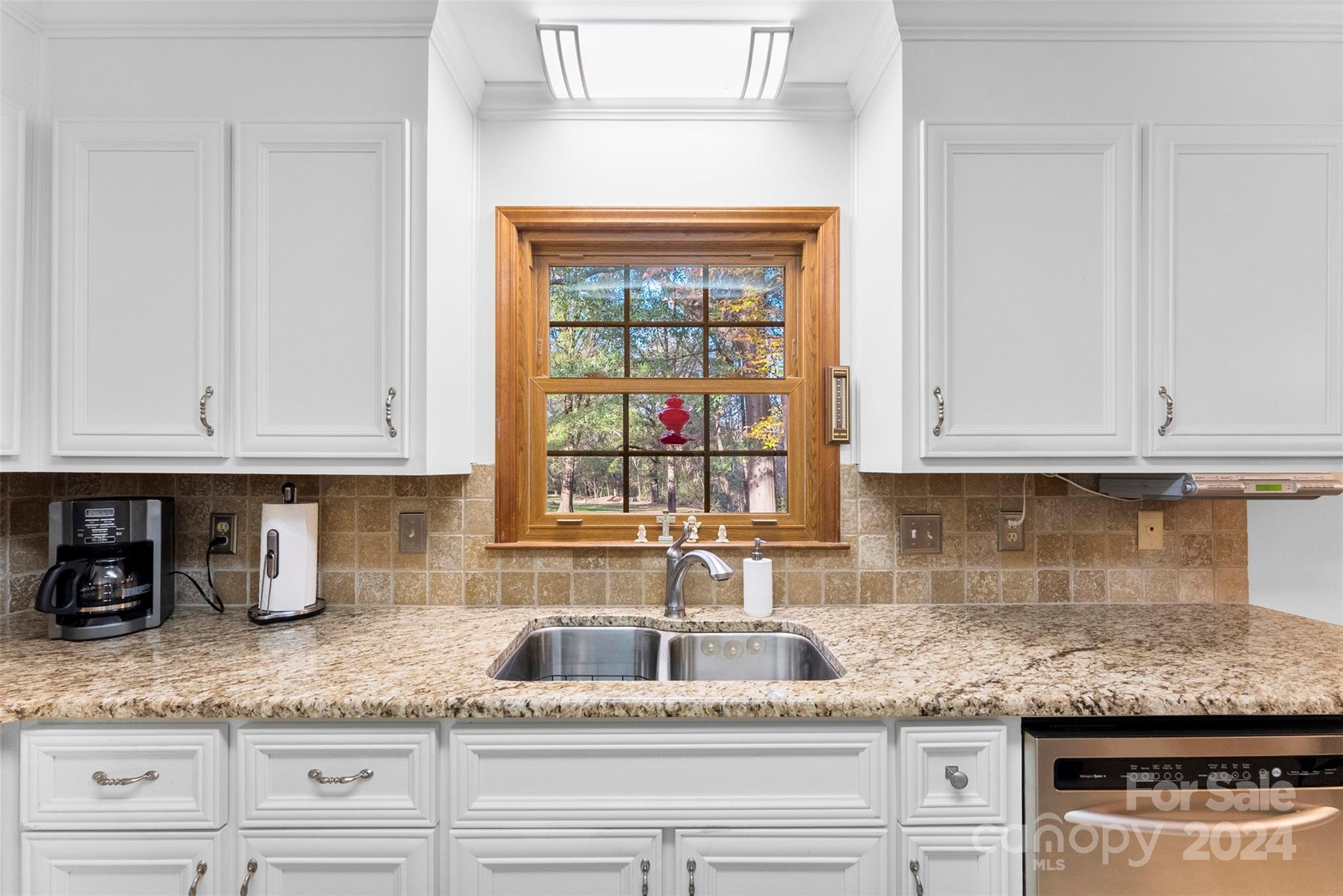 4356 Old Forge Drive Gastonia, NC 28056 - Photo 12 of 39 a kitchen with granite countertop stainless steel appliances white cabinets sink and granite counter top