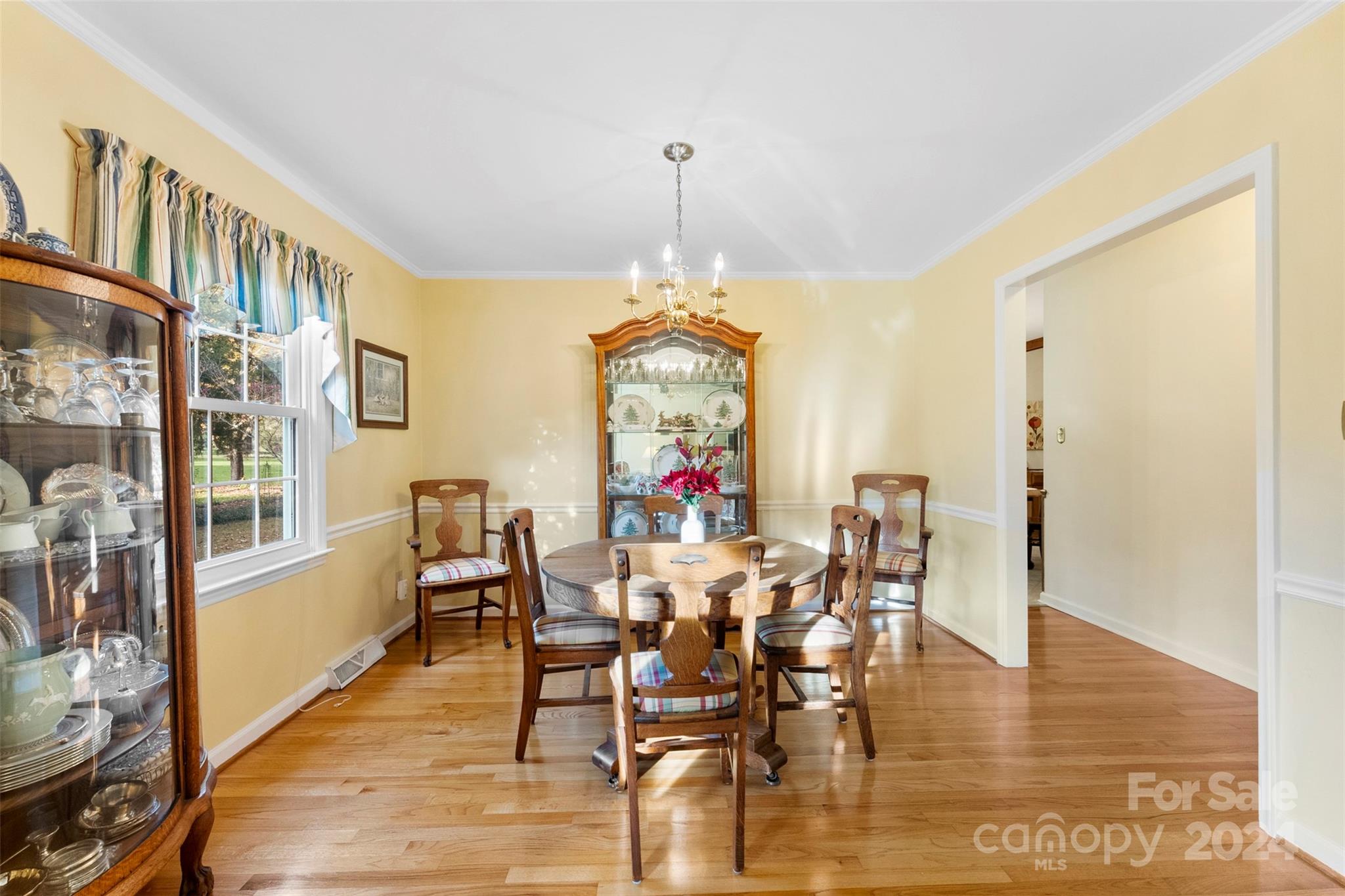 4356 Old Forge Drive Gastonia, NC 28056 - Photo 17 of 39 a view of a dining room with furniture window and wooden floor
