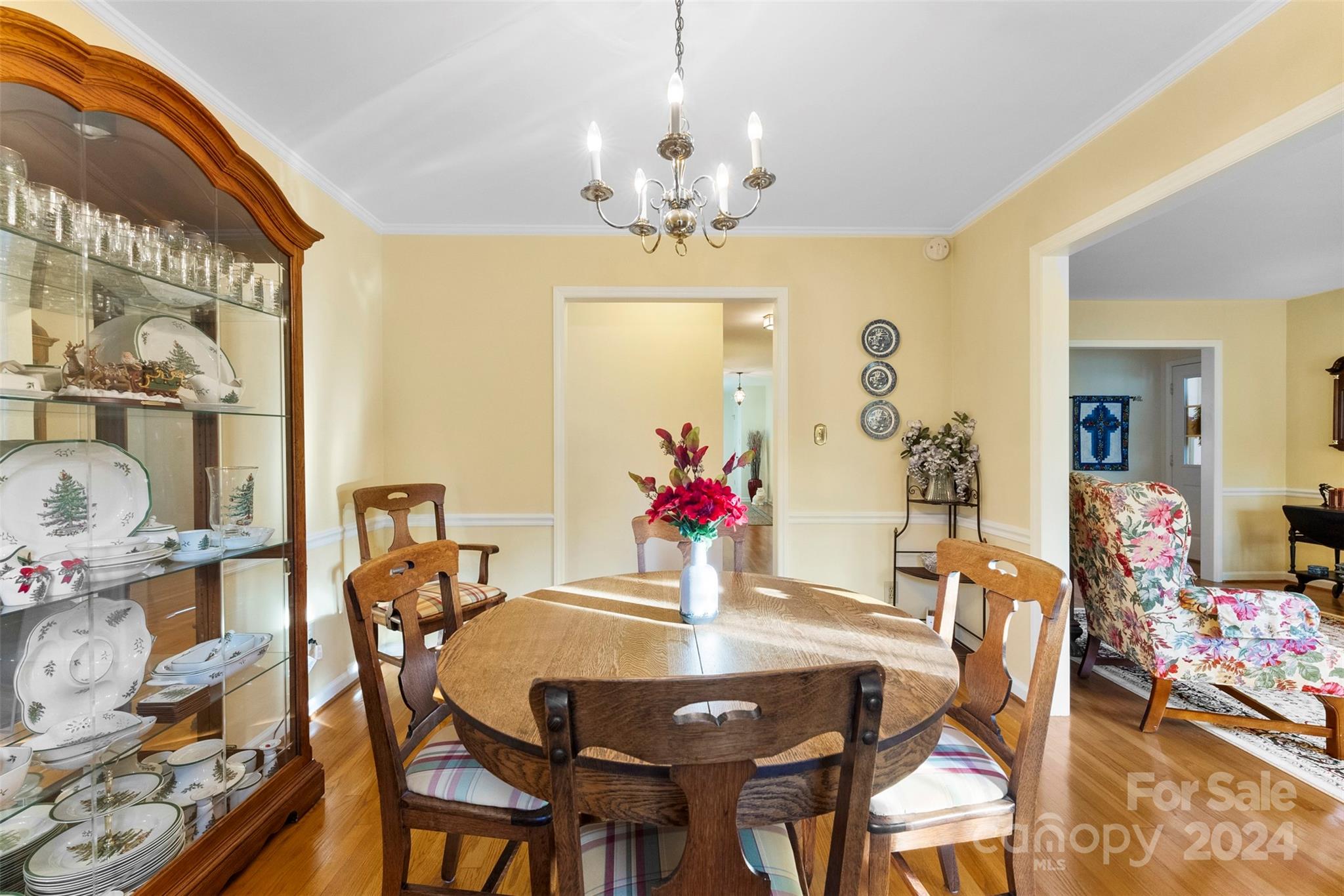 4356 Old Forge Drive Gastonia, NC 28056 - Photo 18 of 39 a view of a dining room with furniture and chandelier