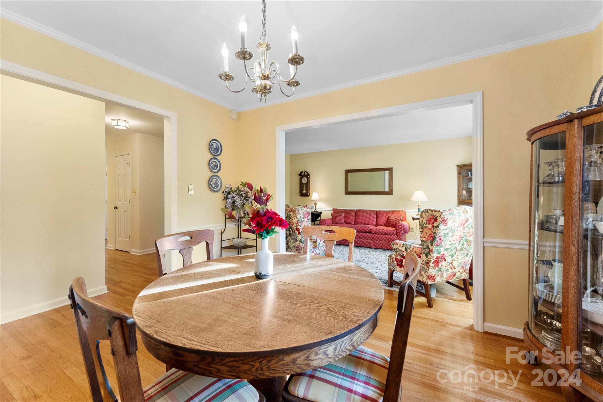 4356 Old Forge Drive Gastonia, NC 28056 - Photo 19 of 39 a view of a dining room with furniture and a chandelier