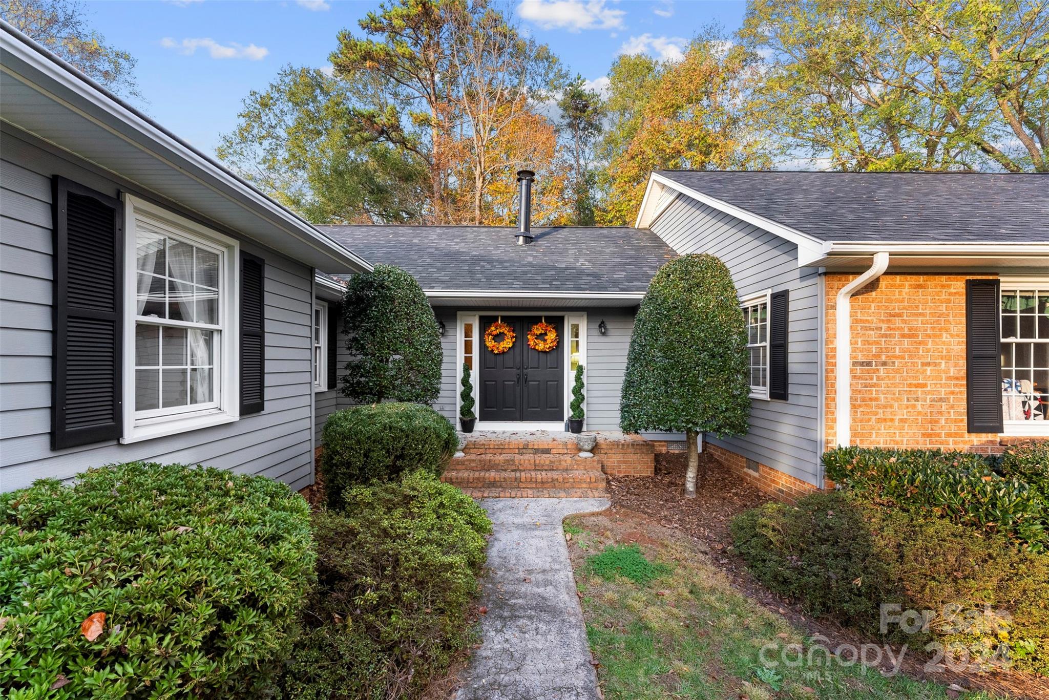 4356 Old Forge Drive Gastonia, NC 28056 - Photo 2 of 39 a front view of a house with garden