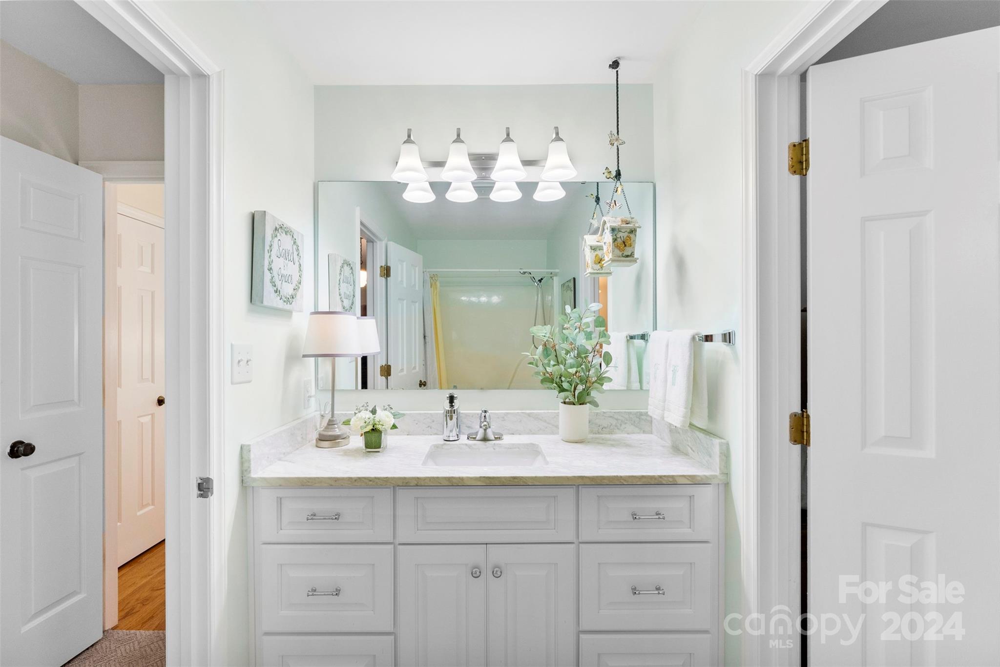 4356 Old Forge Drive Gastonia, NC 28056 - Photo 21 of 39 a bathroom with a sink vanity and a mirror