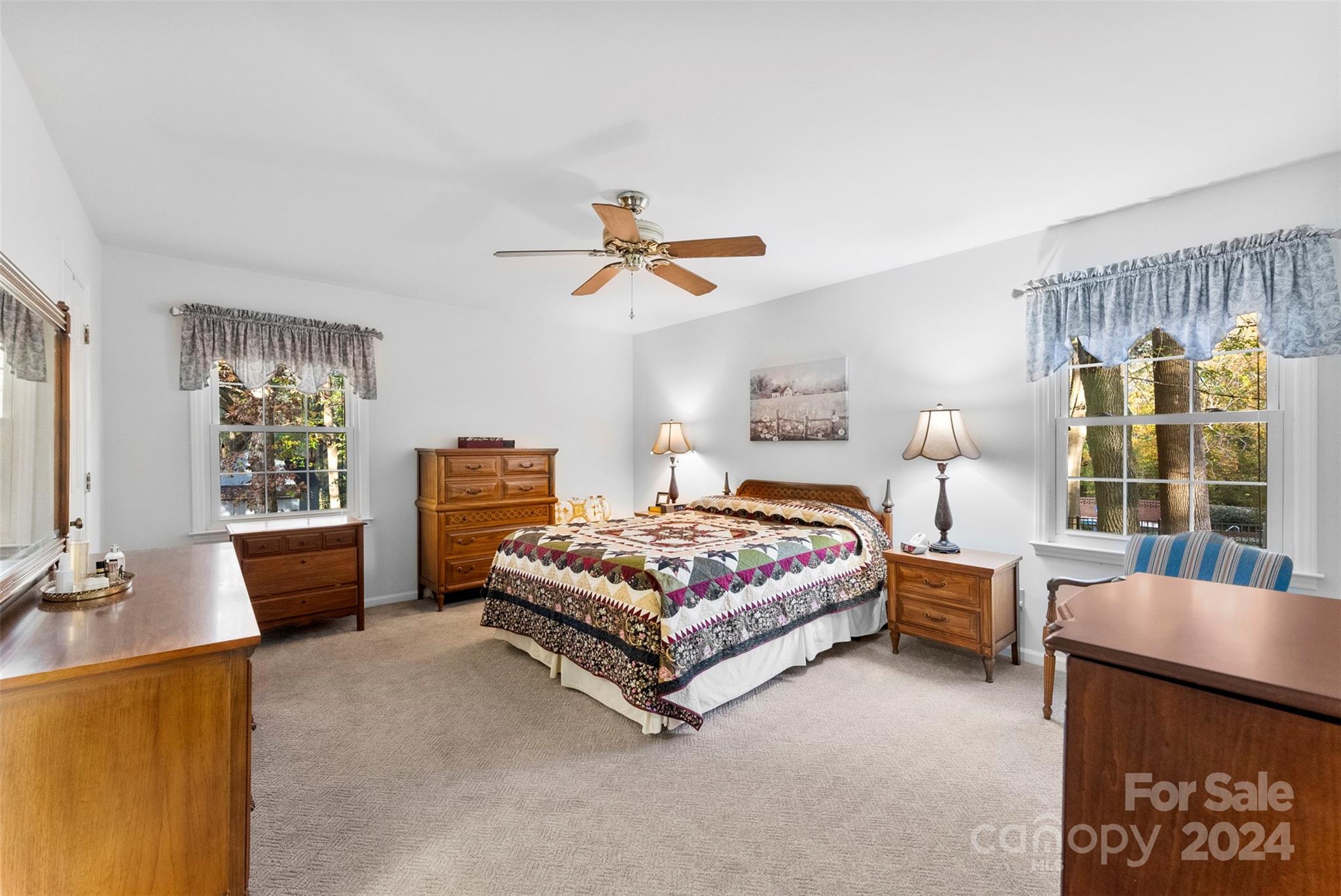 4356 Old Forge Drive Gastonia, NC 28056 - Photo 30 of 39 a bedroom with a bed and a chandelier