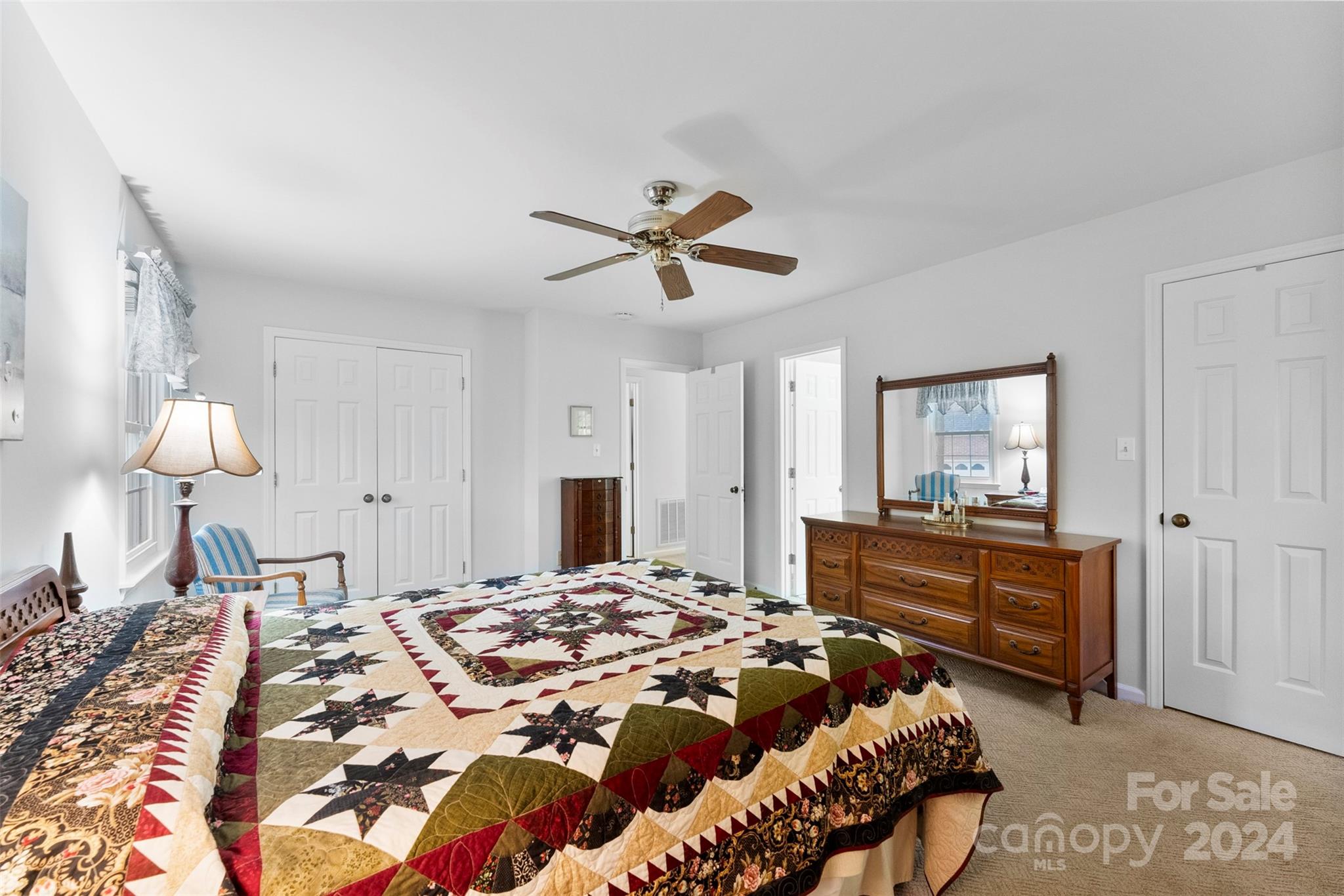 4356 Old Forge Drive Gastonia, NC 28056 - Photo 32 of 39 a bedroom with a bed and a chandelier