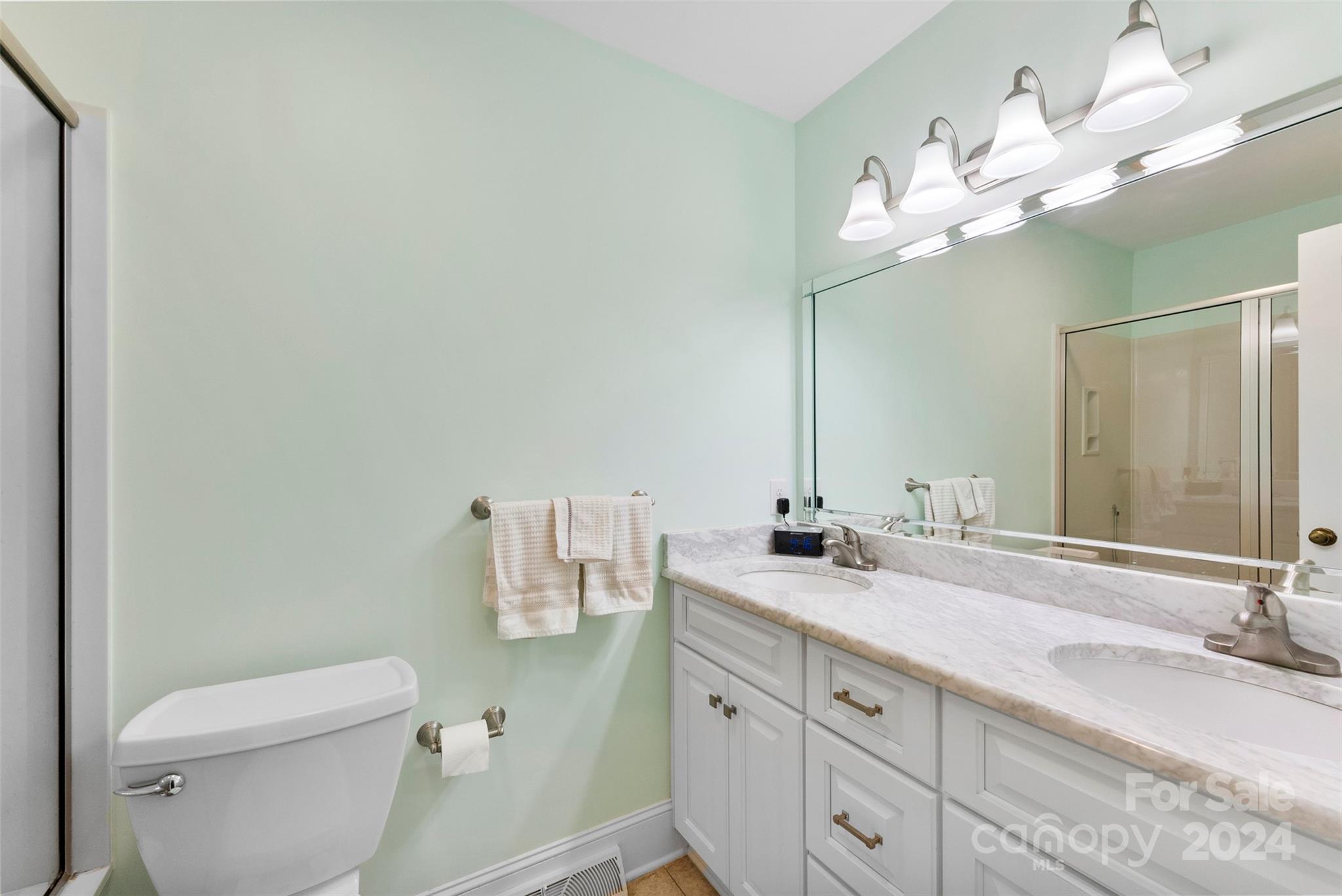 4356 Old Forge Drive Gastonia, NC 28056 - Photo 34 of 39 a bathroom with a granite countertop toilet sink and mirror