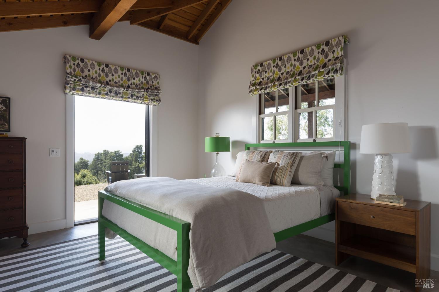 18800 Fitzpatrick Lane Occidental, CA 95465 - Photo 21 of 35 a bedroom with a bed and wooden floor