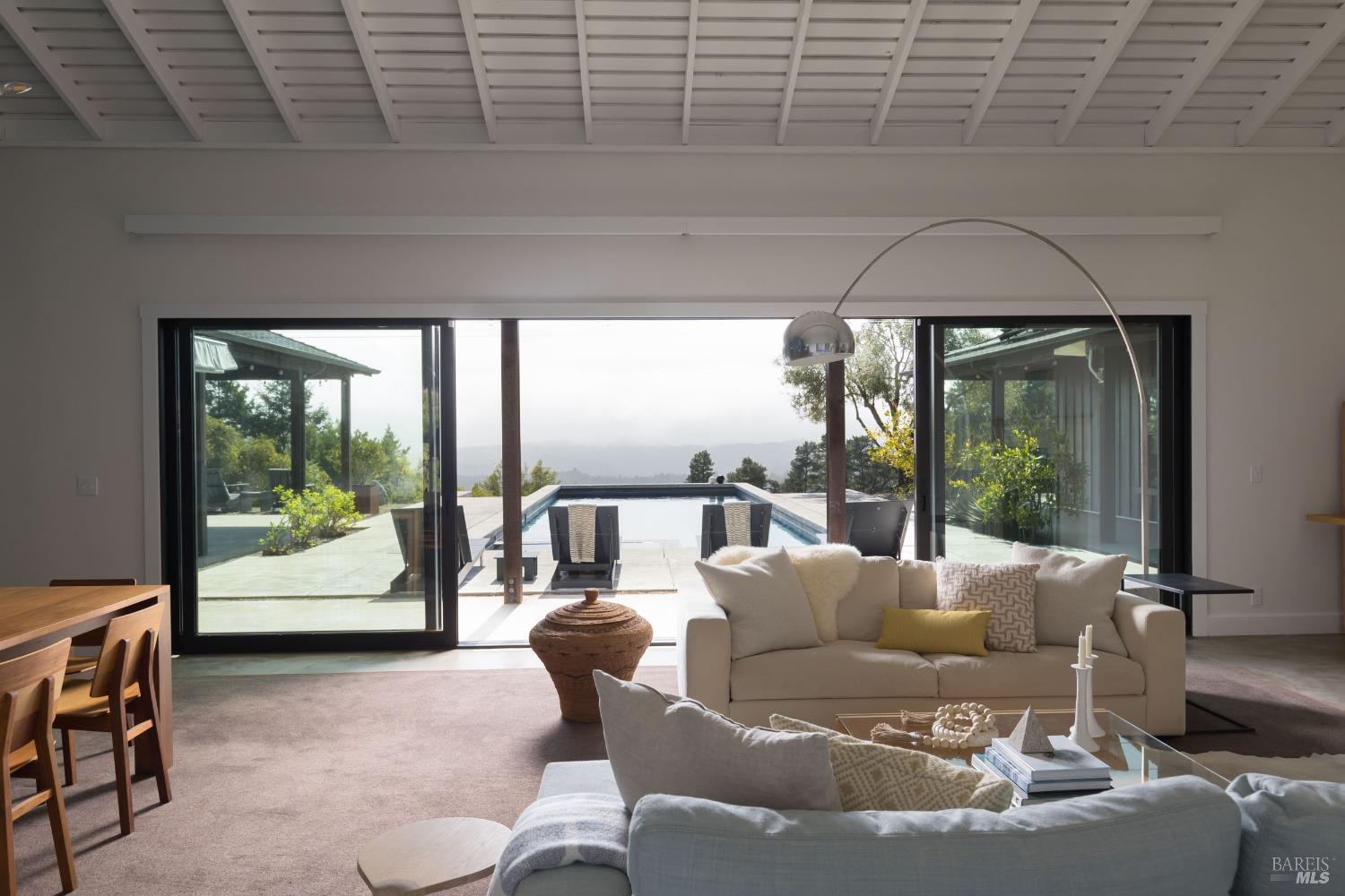 18800 Fitzpatrick Lane Occidental, CA 95465 - Photo 6 of 35 a living room with furniture and a floor to ceiling window