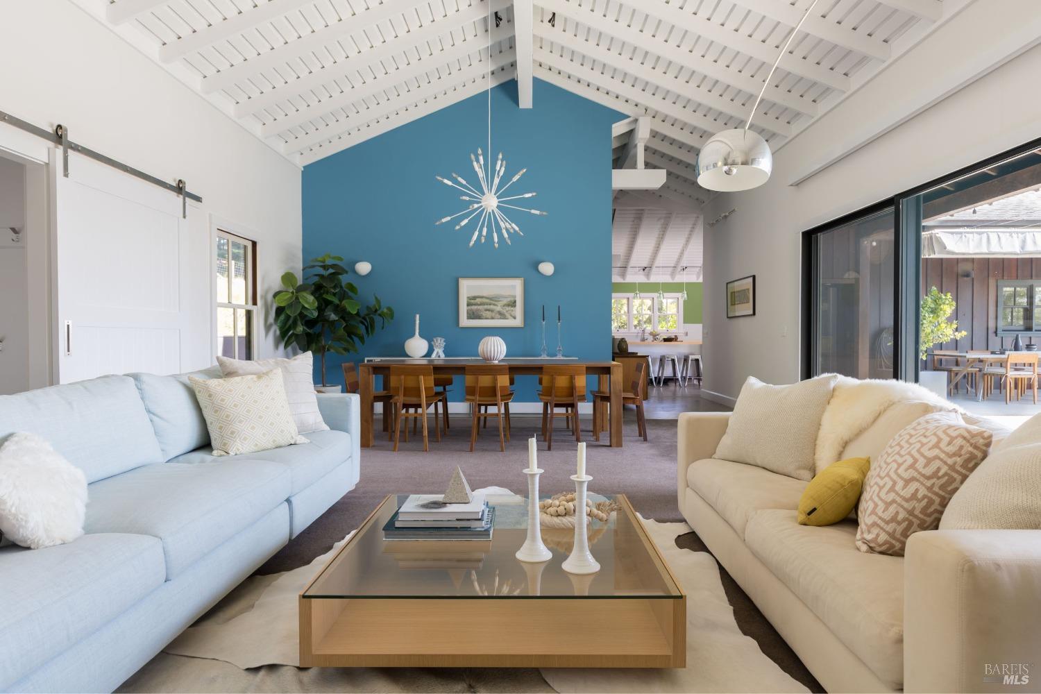 18800 Fitzpatrick Lane Occidental, CA 95465 - Photo 8 of 35 a living room with furniture chandelier and a large window