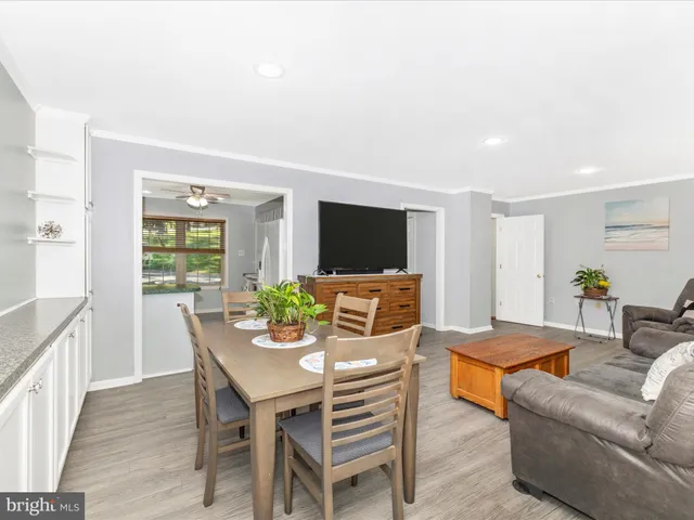a view of a room with a sink and a chandelier