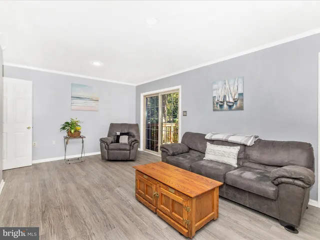 a view of a hallway with furniture
