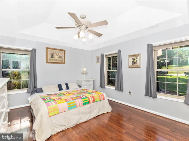 a bathroom with a sink a toilet and shower curtain