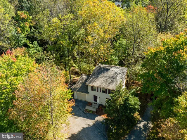 a view of a chair and table on the wooden floor