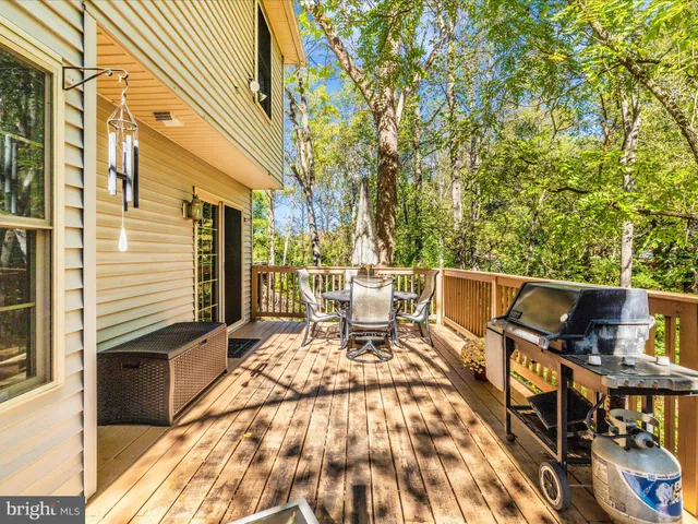 a kitchen with granite countertop white cabinets white stainless steel appliances with a sink and dishwasher