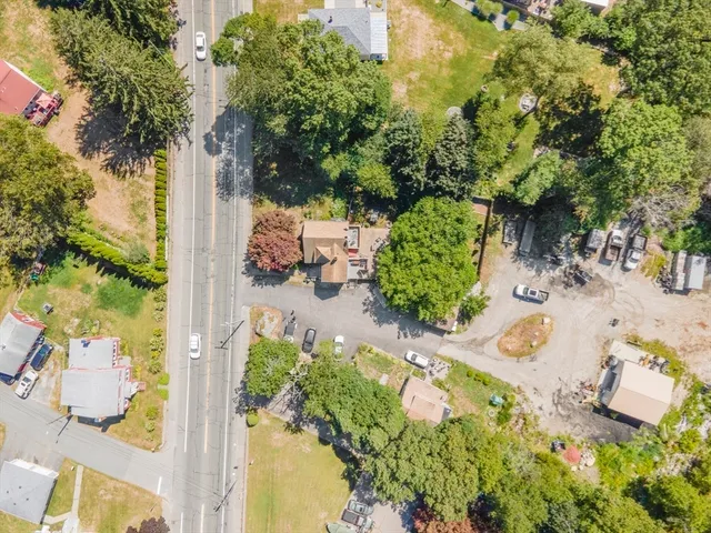 an aerial view of a yard with chairs